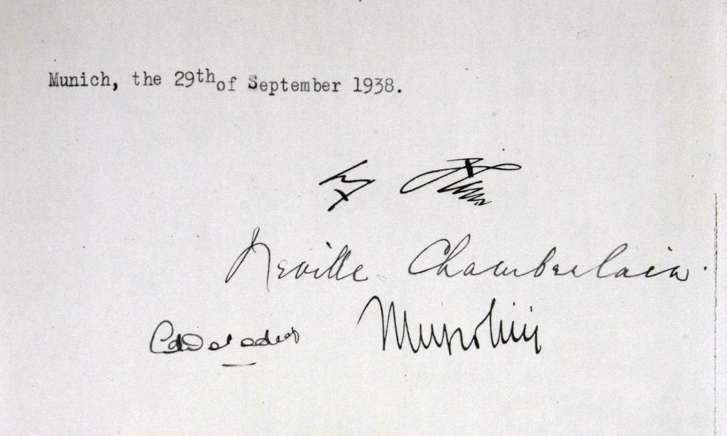 The Munich agreement is signed by Adolf Hitler, Neville Chamberlain, Edouard Daladier and Benito Mussolini, giving Germany the right to claim the Sudetenland